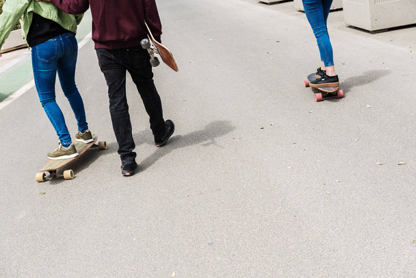 Valencia, Spain - April 29, 2019: Young boys on longboard on a S - Foto, afbeelding