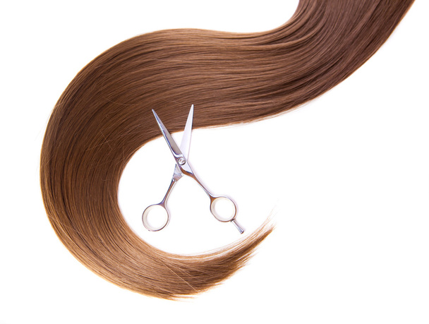 hairdressers scissors and lock of hair - Фото, изображение