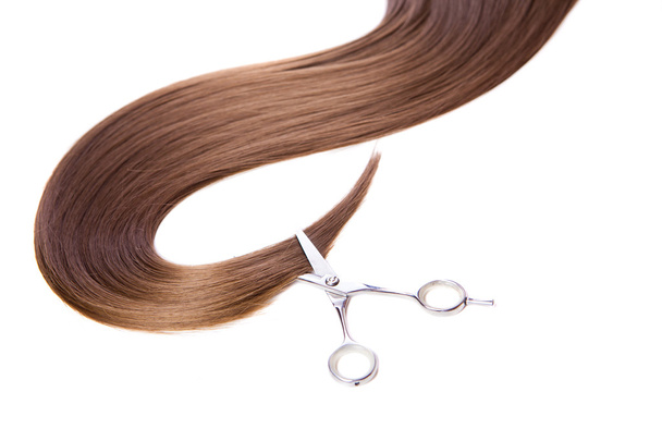 hairdressers scissors and lock of hair - Foto, Imagen