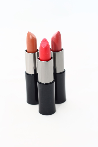 Red lipsticks in a black tube - Photo, Image