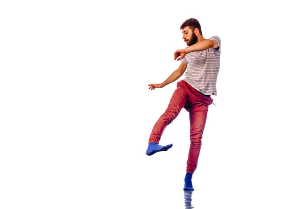 Man is dancing in the studio on a white background - Photo, image