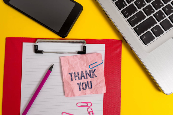 Word writing text Thank You. Business concept for a polite expression used when acknowledging a gift or service Laptop clipboard sheet clips pencil note smartphone colored background. - Fotoğraf, Görsel
