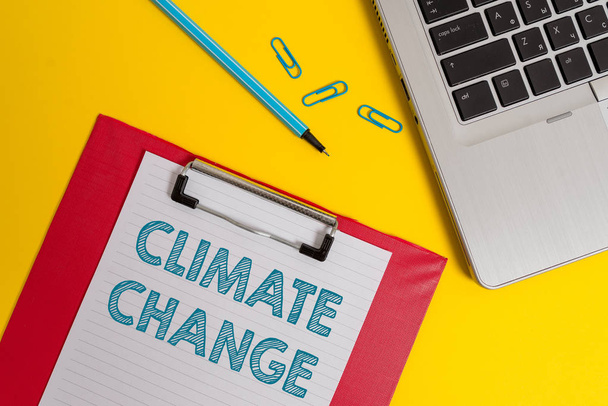 Word writing text Climate Change. Business concept for Increase in global average temperature Weather transformation Open laptop clipboard blank paper sheet marker clips colored background. - Photo, Image