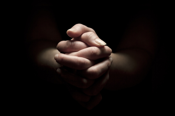 beten mit gefalteten Händen - Foto, Bild
