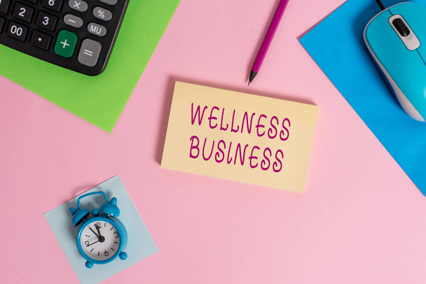 Handwriting text writing Wellness Business. Concept meaning Professional venture focusing the health of mind and body Mouse calculator sheets marker notepad alarm clock colored background. - Fotografie, Obrázek