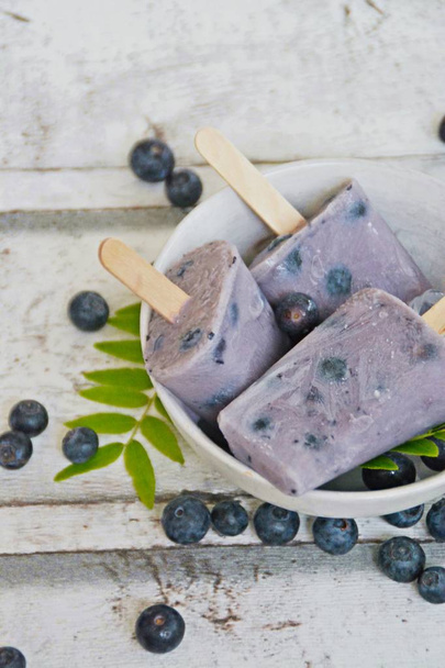 homemade popsicles made out of blueberry and milk - Φωτογραφία, εικόνα