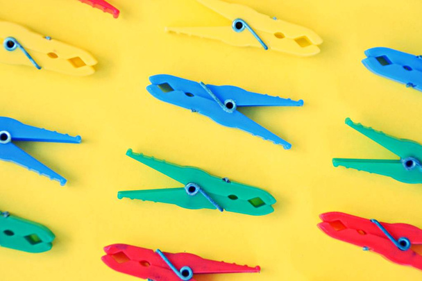 different colored clothespins on colored background  - Photo, Image