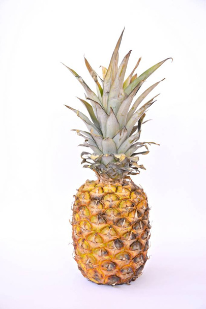 pineapple in front of a colorful background  - Foto, Bild