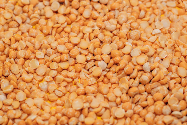 dry red peas scattered on a yellow background close-up. place for text. Texture - Photo, Image