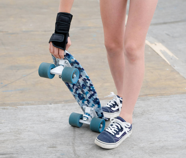 Teen learns to ride a skateboard. - Photo, Image