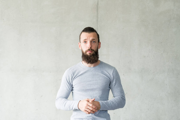 empathy compassion bearded hipster guy gray wall - Foto, Imagem