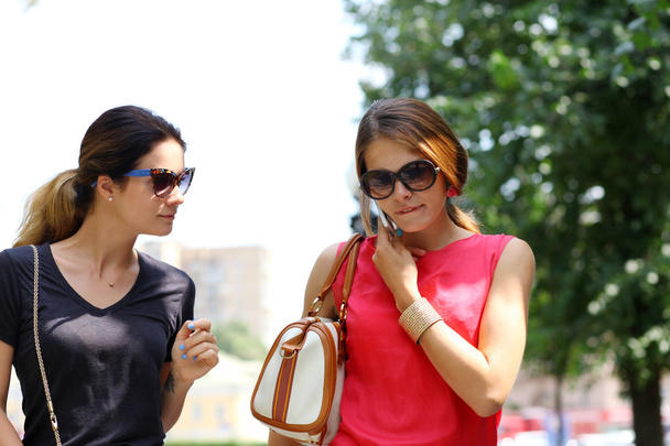 Two young women walking in the summer city - Foto, Imagem