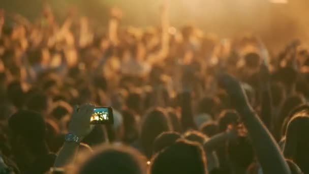 Crowd of fans cheering at open-air music festival - Footage, Video