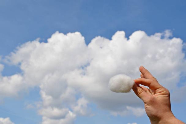 Holding a piece of cloud in your hand  - Photo, Image