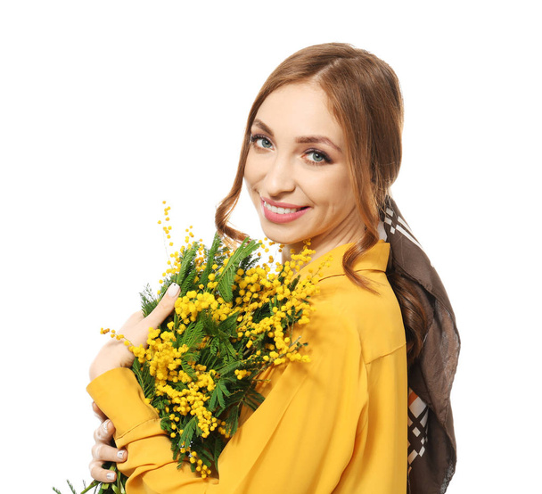 Beautiful young woman with bouquet of mimosa flowers on white background - Fotoğraf, Görsel