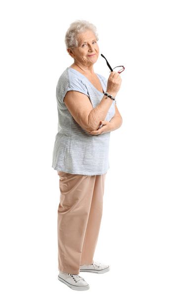 Portrait of senior woman on white background - Foto, afbeelding