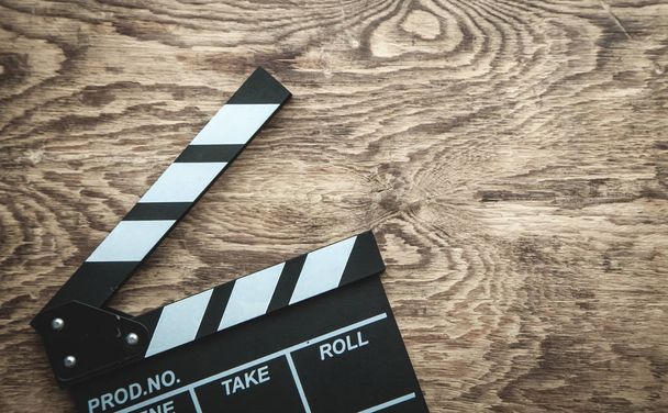 Movie clapper on wooden background. - Photo, Image