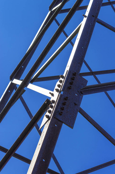 Part of the metal structure against the blue sky.  Front and bottom view - 写真・画像
