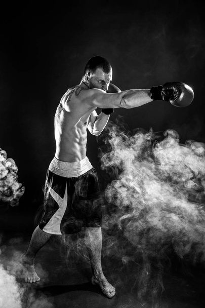 Happy Winning Mixed Martial Arts Fighter Punching in Smoke - Foto, immagini