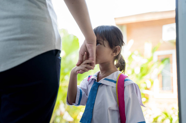 kid kiss her mothers hand before going to school - Φωτογραφία, εικόνα