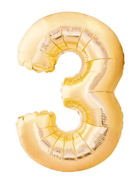 Number 3 three made of golden inflatable balloon isolated on white background. Helium balloon three 3 number - Photo, image