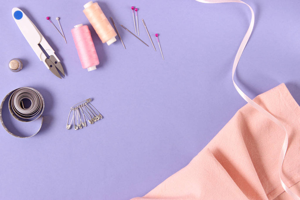 sewing accessories on a colored background top view. - Foto, Imagem