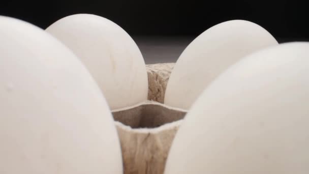 Raw fresh egg in pack on whitetable, slide shoot - Felvétel, videó