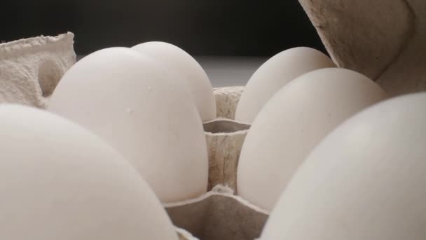 Raw fresh egg in pack on whitetable, slide shoot - 映像、動画