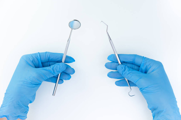 Dentist in medical gloves working with professional stomatology  - Photo, Image