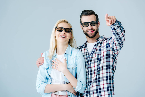 happy man and girl in 3d glasses watching movie isolated on grey - Foto, afbeelding