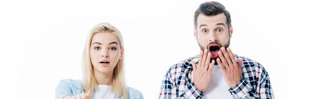 panoramic shot of girl pointing with finger and surprised man covering mouth Isolated On White - Фото, зображення