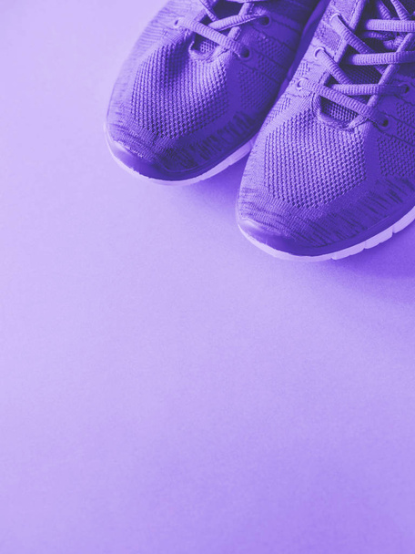 Purple trainers on monochrome background. - Photo, Image