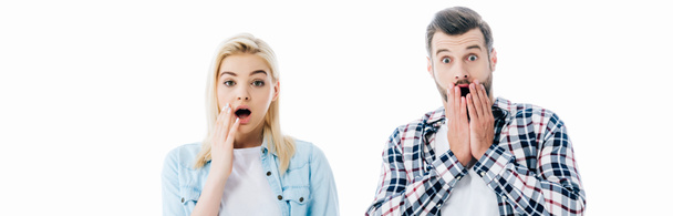 panoramic shot of surprised girl and man covering mouths Isolated On White - Fotografie, Obrázek