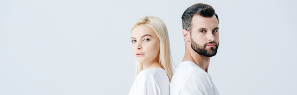 panoramic shot of man and young woman in white T-shirts isolated on grey - Foto, afbeelding