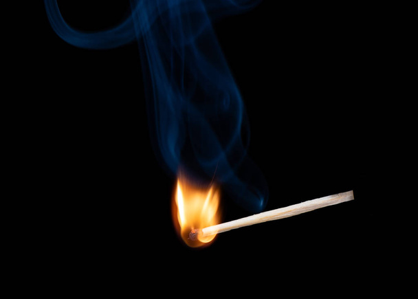 Wooden match with a sulfur head at the moment when it explodes. - Fotoğraf, Görsel