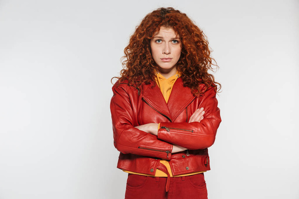 Portrait of an attractive redhead young woman standing - Φωτογραφία, εικόνα