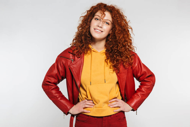 Portrait of an attractive redhead young woman standing - Φωτογραφία, εικόνα
