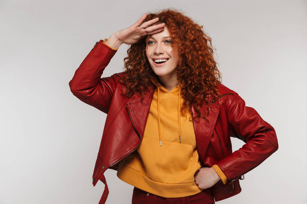 Portrait of pretty redhead woman 20s wearing leather jacket smil - Foto, Imagen