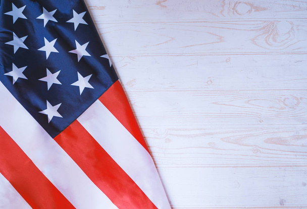 Flag of United States of America on white wooden background. 4th - 写真・画像