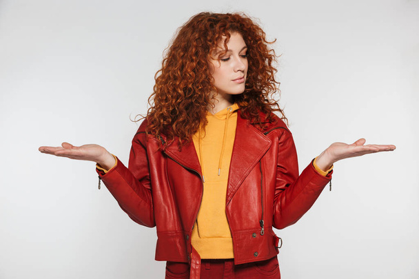 Portrait of young redhead woman 20s wearing leather jacket smili - Fotó, kép
