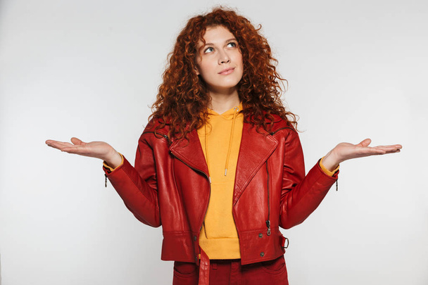 Portrait of caucasian redhead woman 20s wearing leather jacket s - Foto, imagen