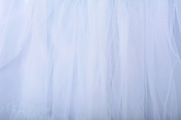 Blue fabric texture background. The skirt is made of tulle - Photo, image