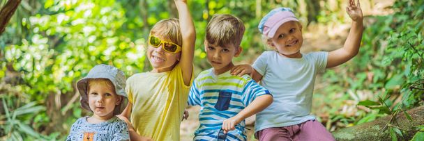 Children rest during a hike in the woods BANNER, LONG FORMAT - Foto, Bild