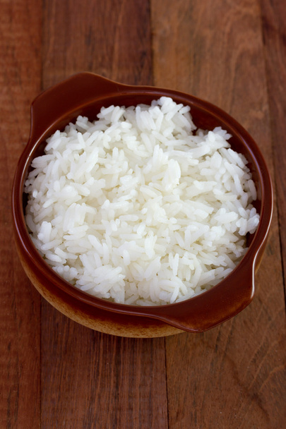 Boiled rice in dark bowl - Fotografie, Obrázek