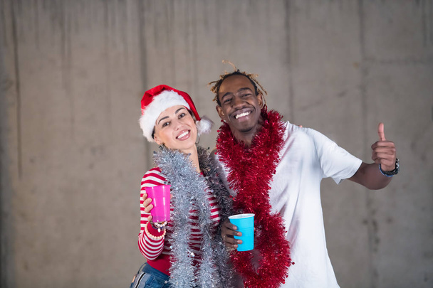 young multiethnic business couple celebrating new year party - Foto, Imagem