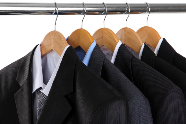 Suits with shirts on hangers on white background - 写真・画像