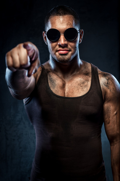 Muscular handsome young man in sunglasses pointing on you - Fotografie, Obrázek