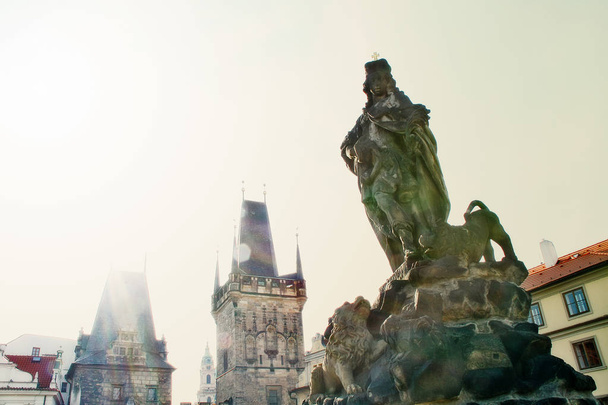 Statue of St. Ludmila on Charles bridge (Karluv Most) with lesser town in background, Prague (Praha), Czech Republic (Ceska Republika), Bohemia - Foto, immagini