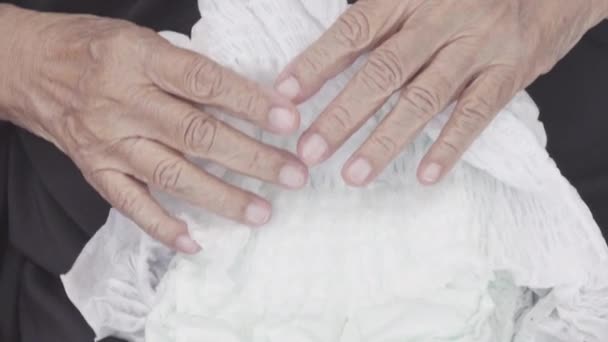 elderly woman changing diaper - Footage, Video