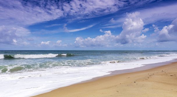 Beautiful Tropical sandy beach with blue ocean and blue sky  - Fotoğraf, Görsel